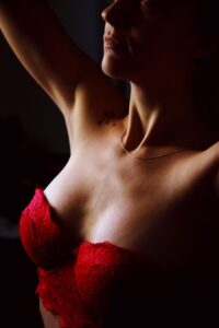Woman with a red bra posing for the camera
