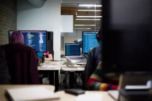 technicians working on their computers