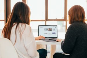 women reviewing a website website conversion