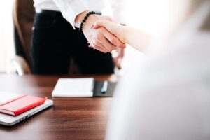businesspeople shaking hands small business loan terms