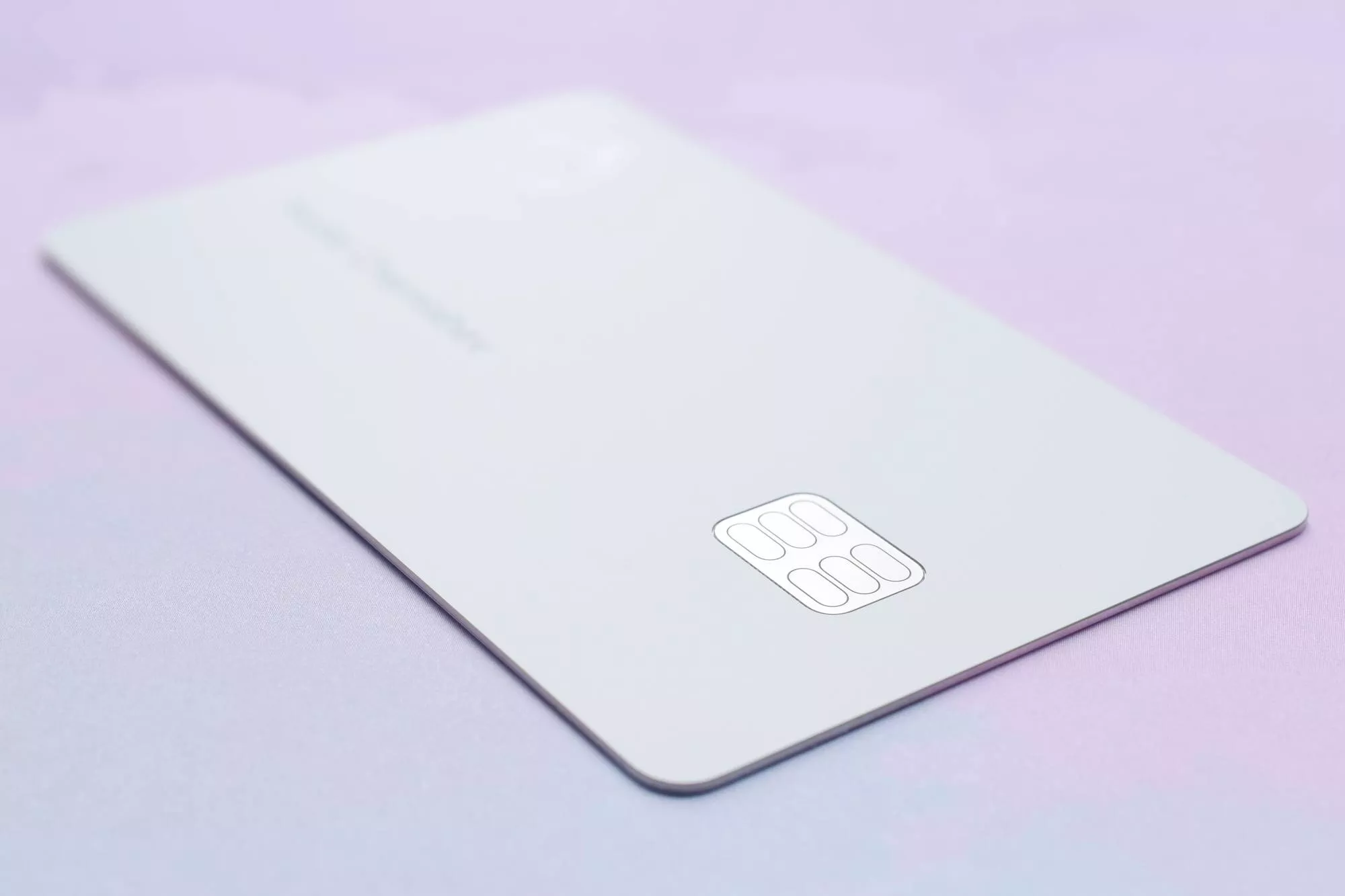 a credit card on a purple background ready to be used for storing credit card information