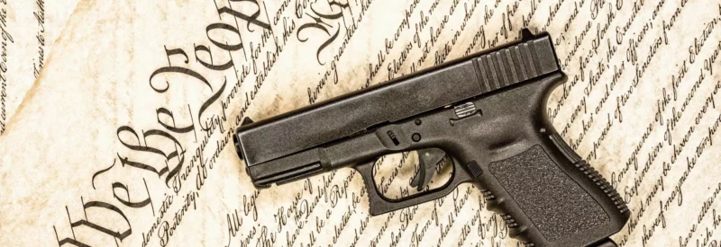a handgun on United States Constitution that dictates gun laws