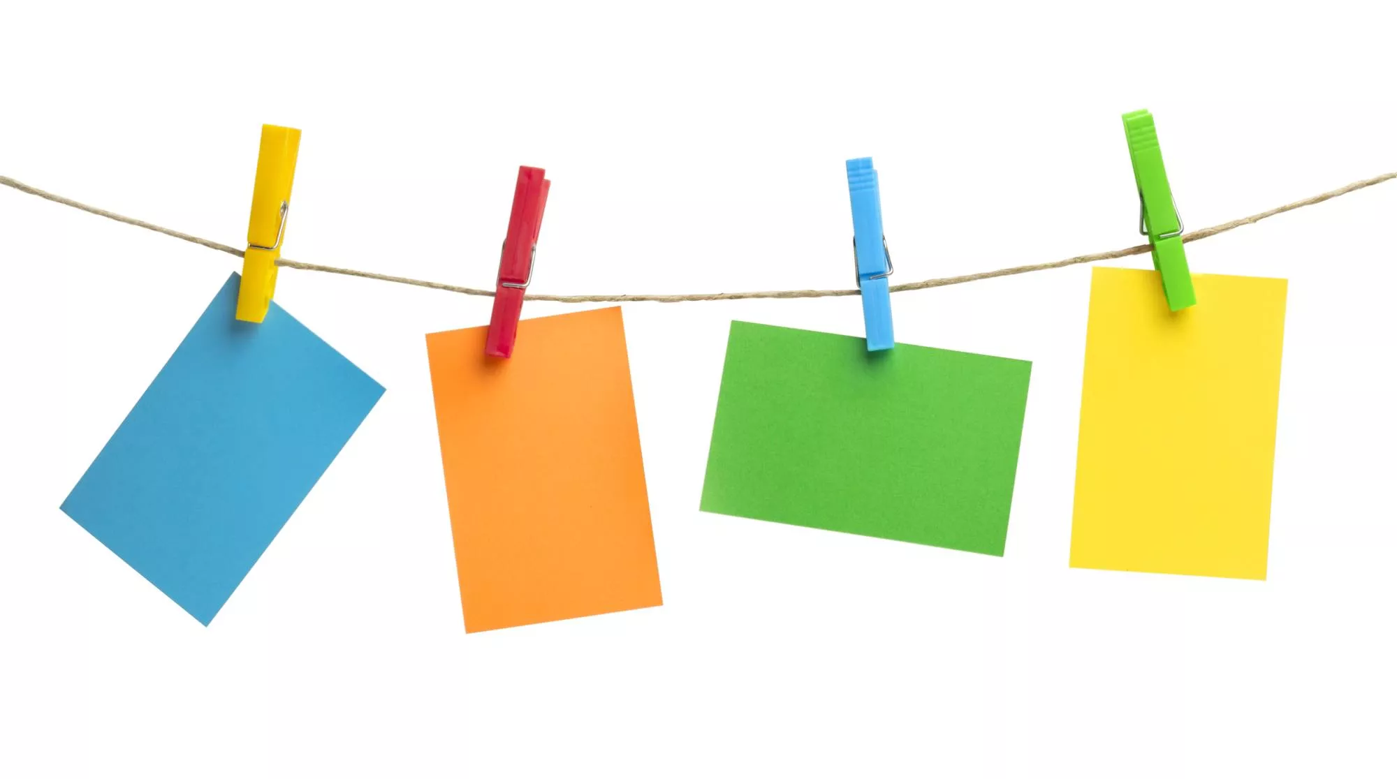 colorful note cards hanging on a string with clips ready for someone to write how to write a business plan