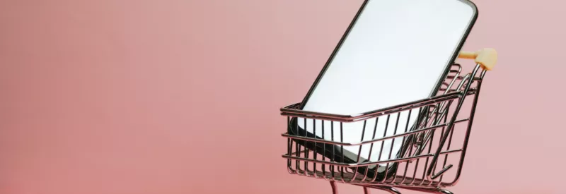 smartphone in shopping cart for starting an ecommerce business in 2023