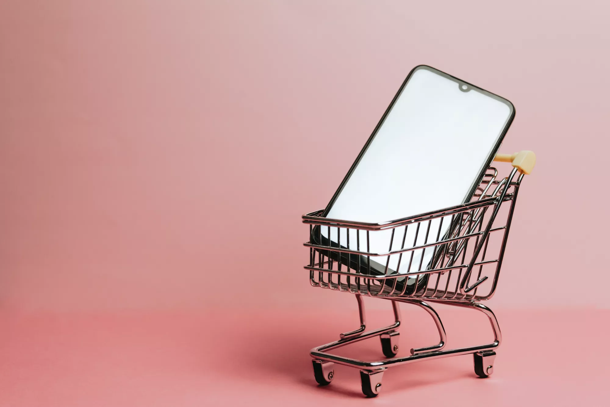 smartphone in shopping cart for starting an ecommerce business in 2023