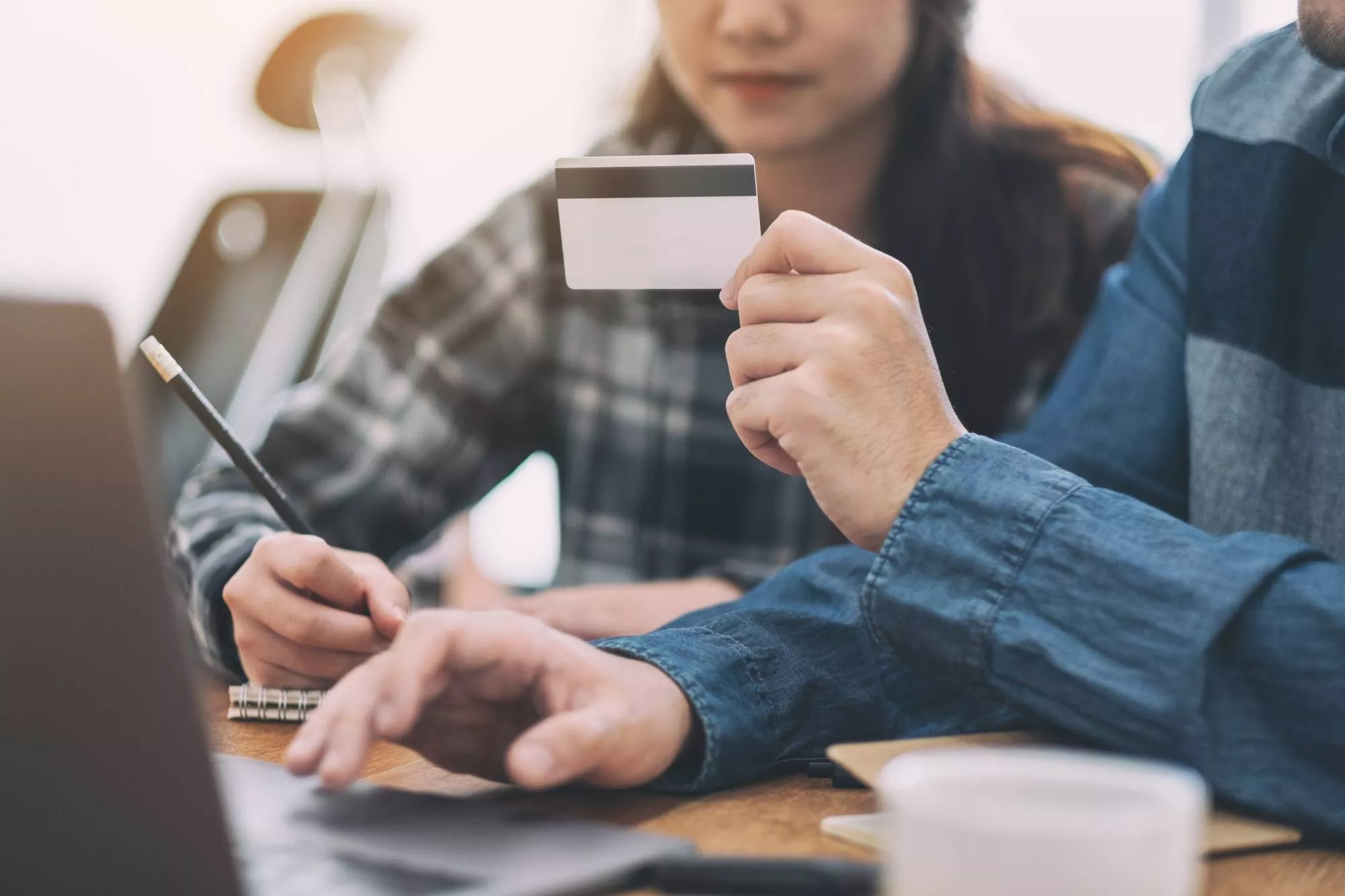 man and woman studying return codes at desk