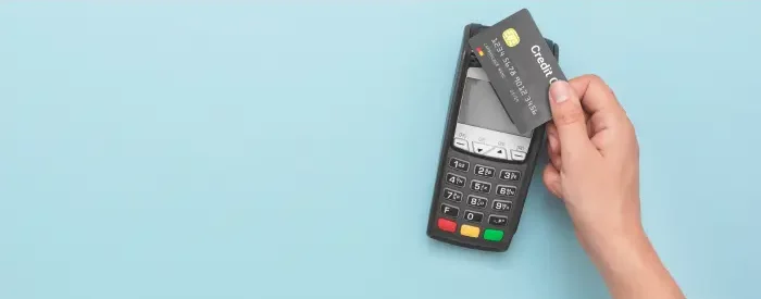 A credit card terminal being used for payment processing.