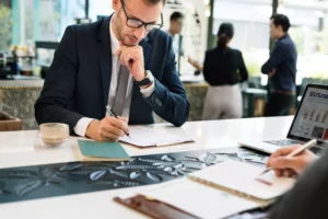 businessman filing out ACH form