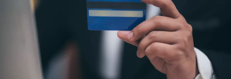 man holding credit card for authorization