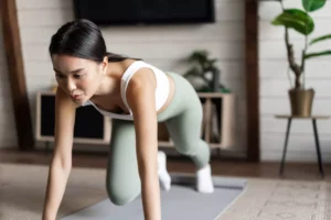 woman practicing yoga at home - ecommerce product ideas