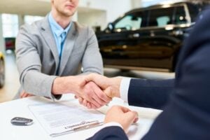 man agreeing to purchase authorization at car rental