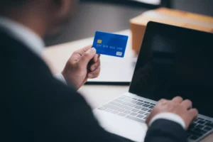 man holding credit card for his small business line of credit requirements