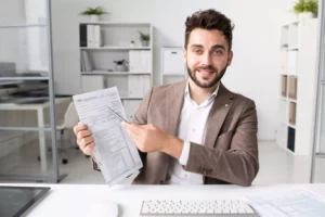 accountant holding tax files he prepared with TIN ID