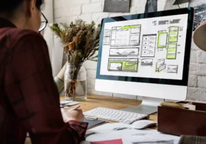 woman looking up how to make a website on her computer