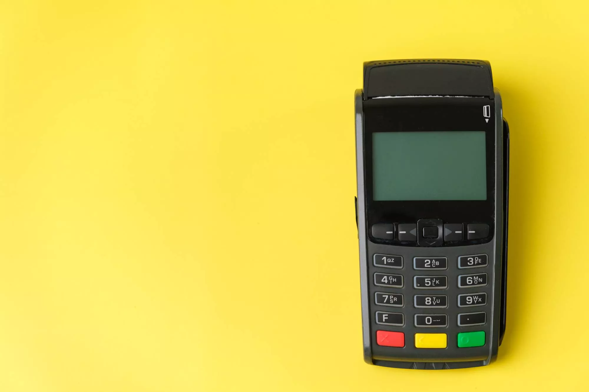 credit card reader against yellow background