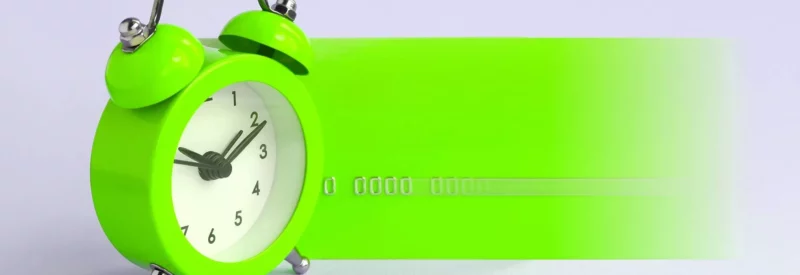 neon green ticking clock and credit card symbolizing batch processing