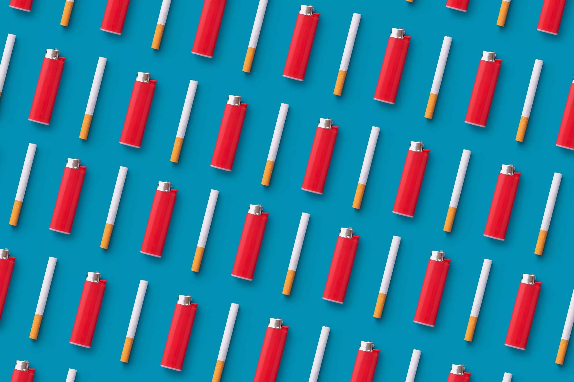 cigarettes and red lighters on blue background that you can sell if you have a tobacco license