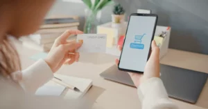 person holding phone and checking out on with afterpay