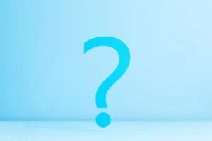 A dark blue question mark on a light blue background symbolizing the question of "What does ACH return code R37 mean?"