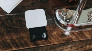 A card inserted into a Square chip and contactless payment reader
