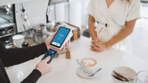 a business owner inserting a credit card into a Square terminal