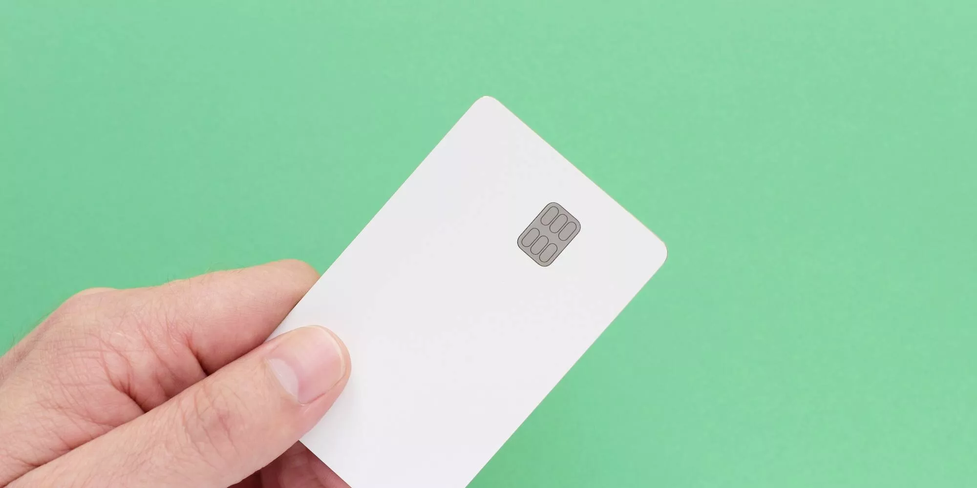 someone deciding between square vs paypal holding a credit card on a green background