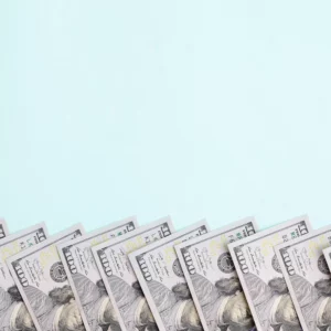 one hundred dollar bills against blue background symbolizing stripe holding funds