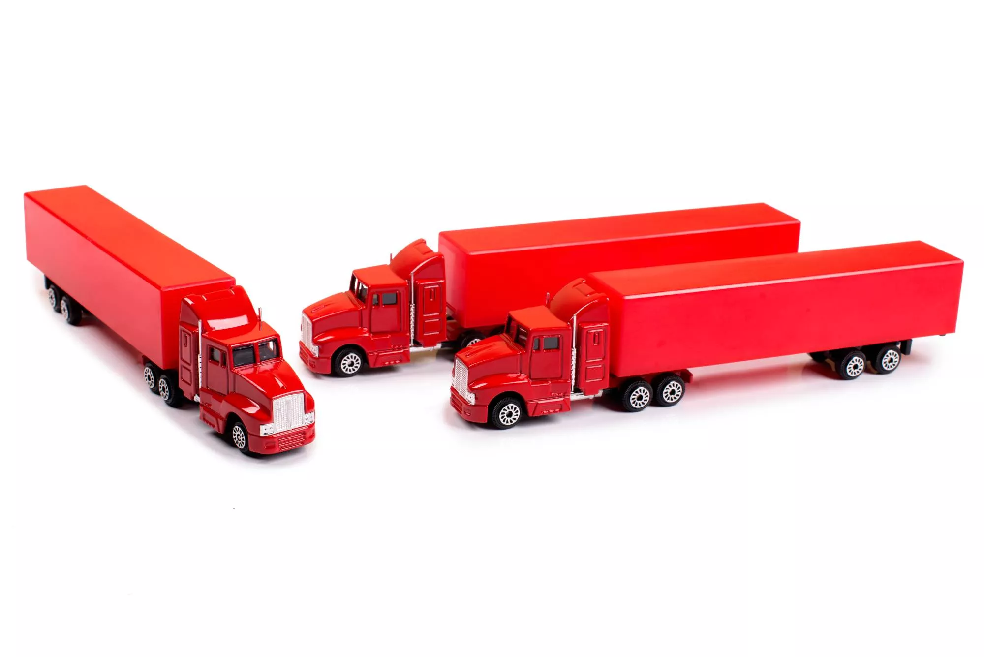 three red trucks after getting an mc number on a white back ground