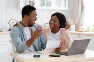 Two people excited that they got approved for a minority small business grant 