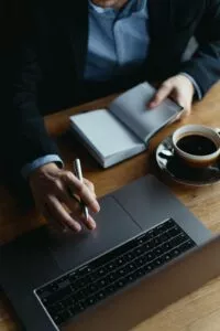 person using their laptop to look up their TIN