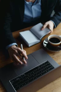 person using their laptop to look up their TIN