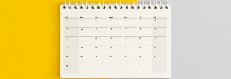 a calendar on split gray and yellow background: what is sezzle