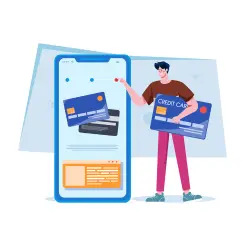 A man, holding a credit card, setting up a credit card account updater.