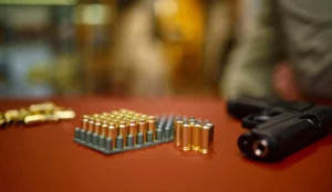 ammunition and gun on a table after receiving a Virginia FFL