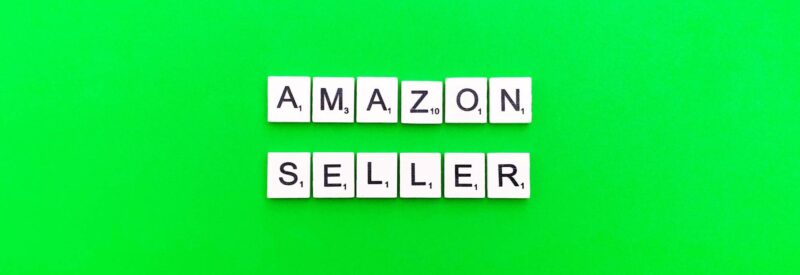 word blocks that spell amazon seller on a neon green background