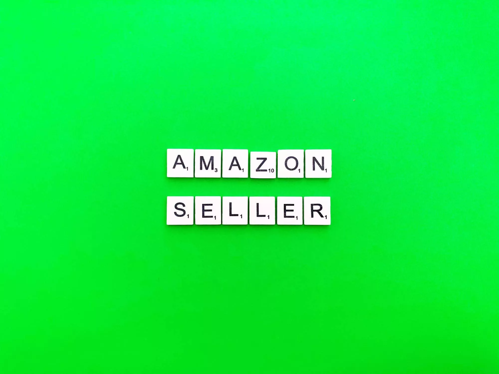 word blocks that spell amazon seller on a neon green background