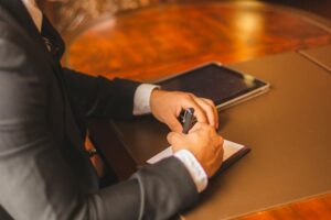 a banker writing on a desk after finding out what is check truncation