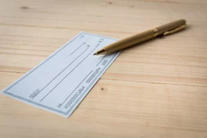 a blank check on a table that will be used for check fraud