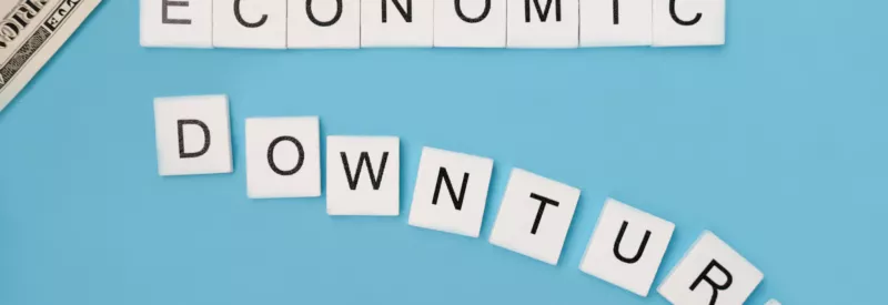economic downturn spelled with wooden letters during recession