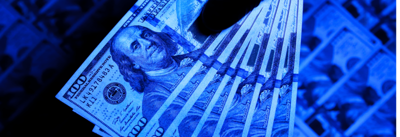 counterfeit money under UV light