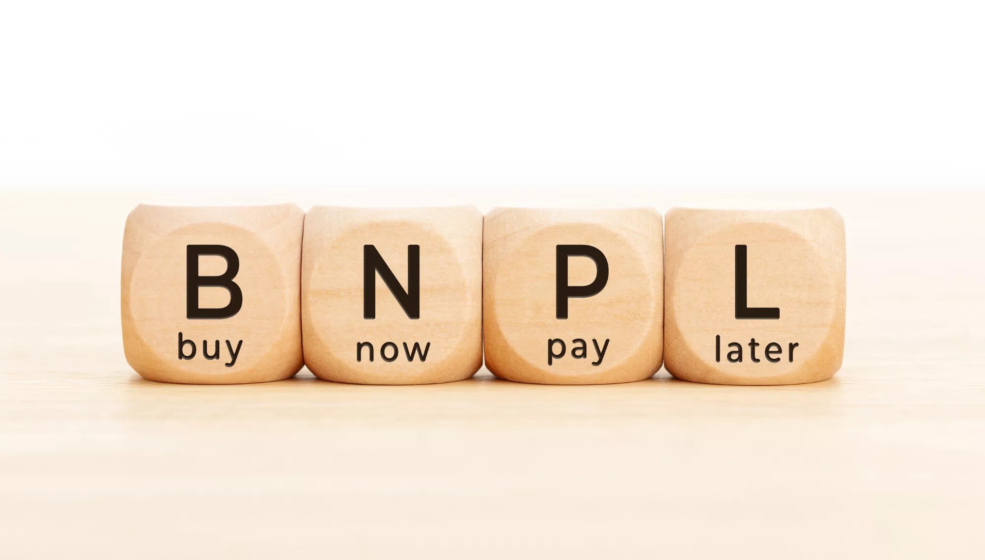 Scrabble letter blocks reading BNPL representing Perpay