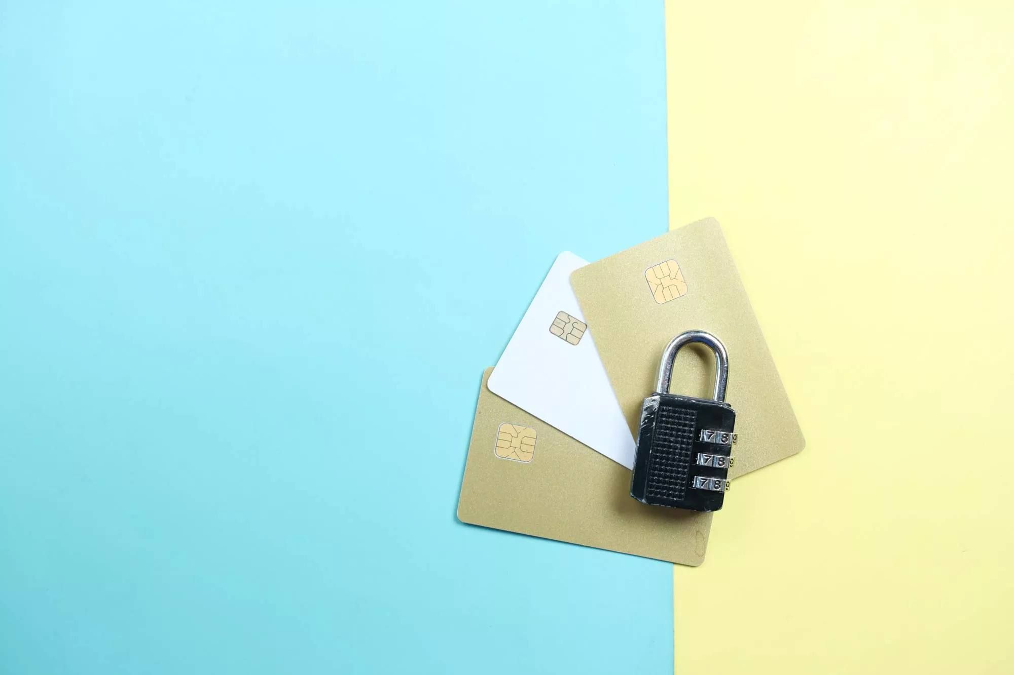 image of three credit cards with a lock on top on a blue and yellow background to show the security of a signature panel code