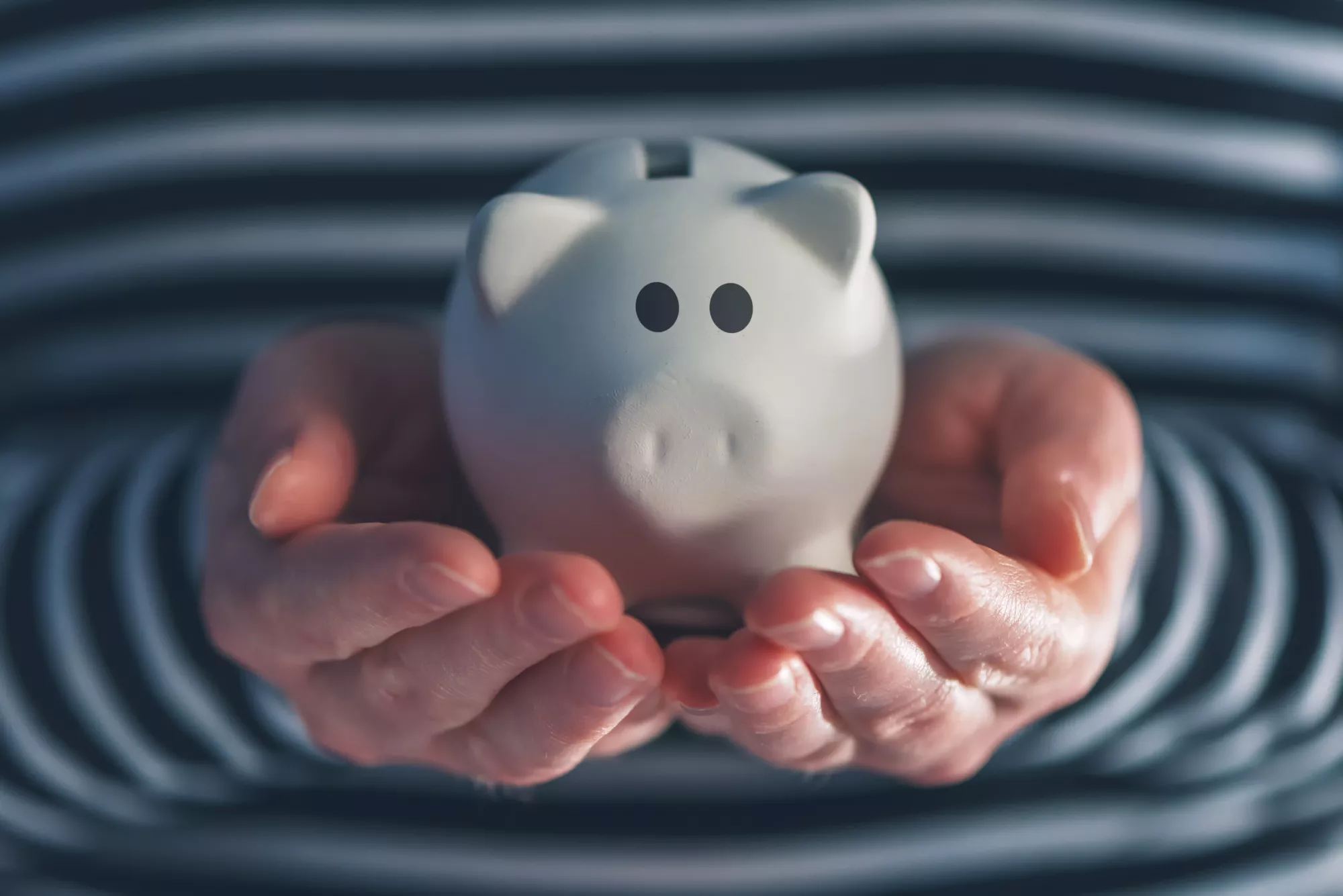 woman holding piggy bank in her hands because she received ACH return code R45