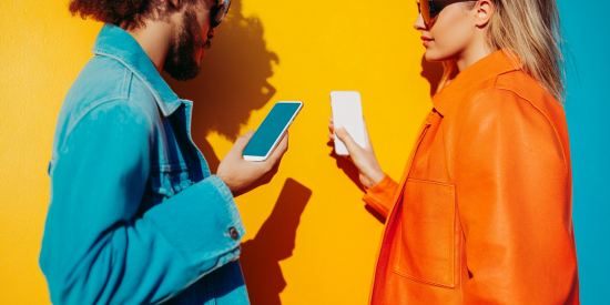 Two people paying each other with payments application on their phones