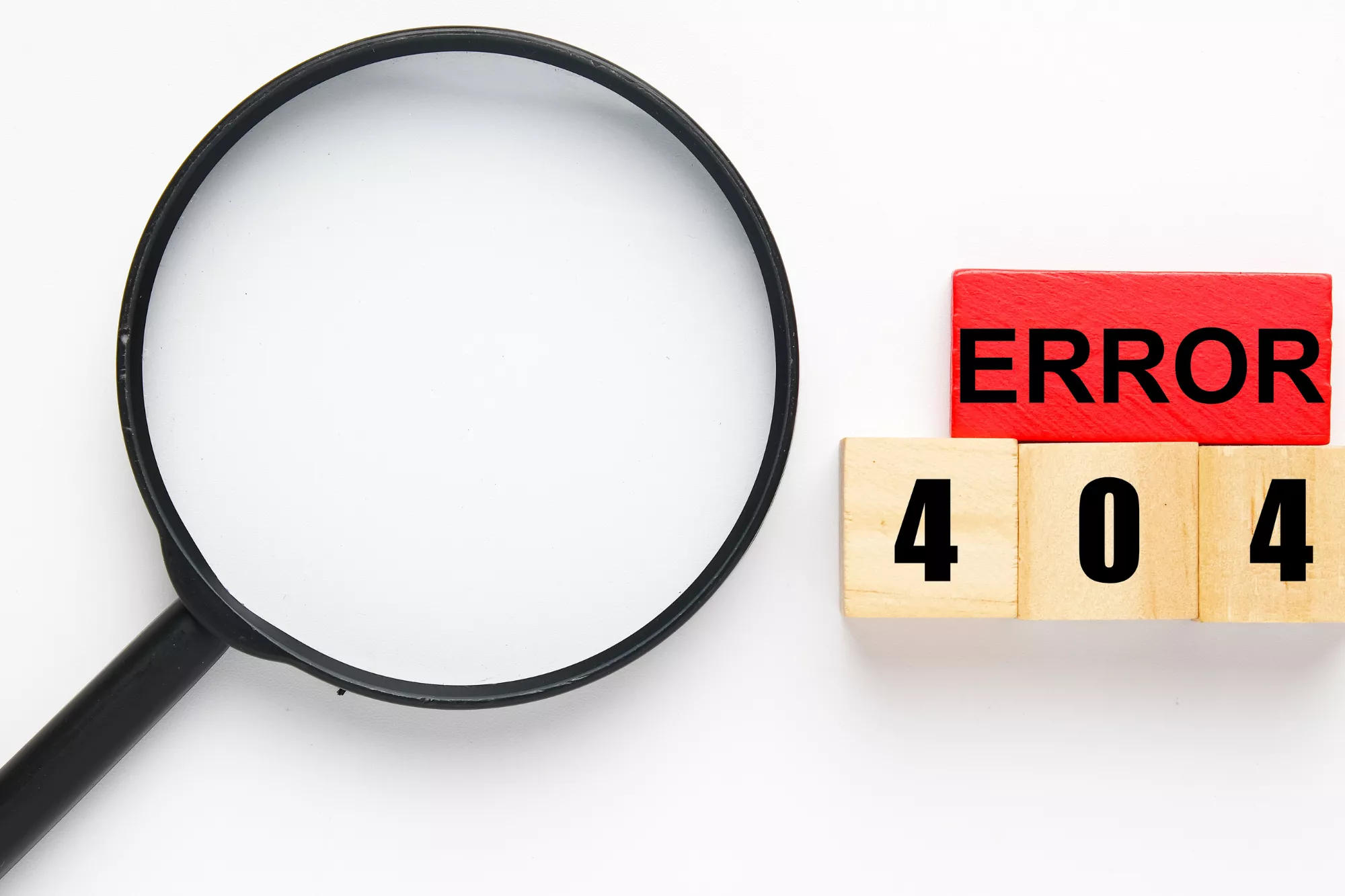 a magnifying glass next to blocks spelling out "error 404" to represent ACH return code R65