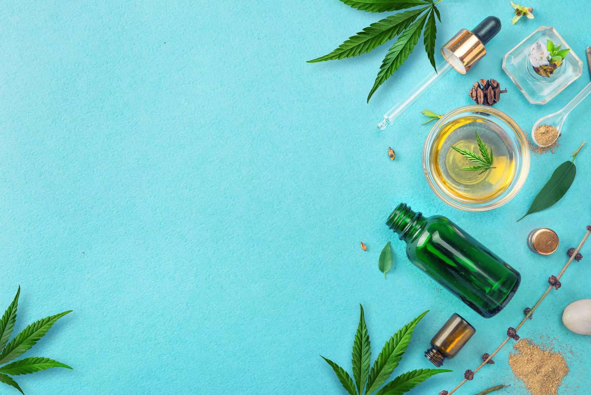 Various CBD products and hemp leaves from a business owner selling CBD on Etsy against a blue background.