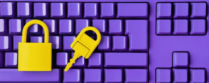 lock and key on purple computer keyboard