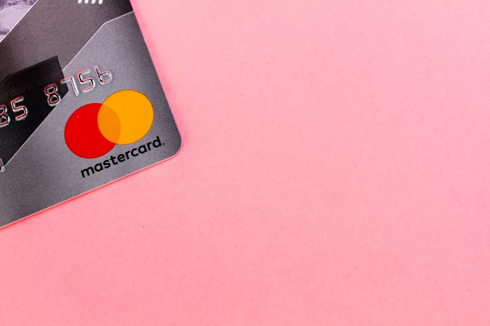 a mastercard with securecode on a pink background