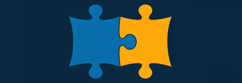 Two puzzle pieces fitting together