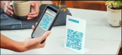 A customer paying with the QR code feature available to Venmo for business account holders.